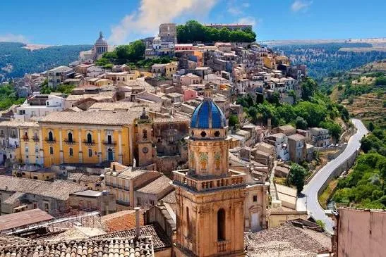 Panoramic view of the grand historic estate surrounded by scenic Sicilian countryside in Donnafugata.