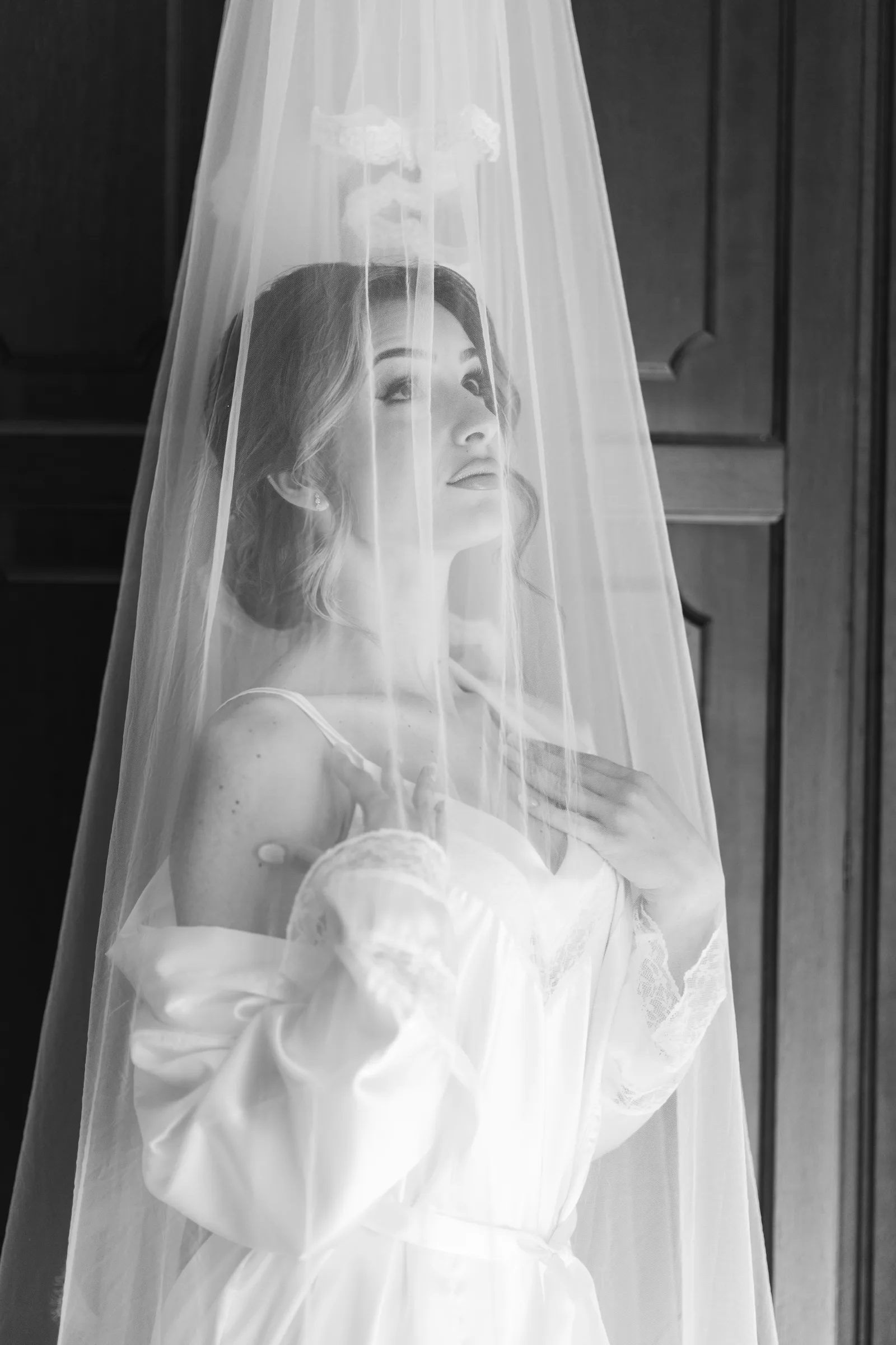 romantic portrait of a bride under her lace veil before destination wedding ceremony in Sicily