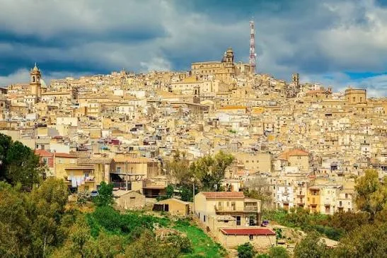 Panoramic view over the historic hilltop townscape and baroque rooftops of Caltagirone, Sicily.