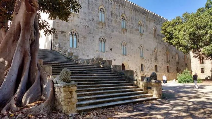 Picturesque pathway winding through the lush Mediterranean park and historic gardens in Donnafugata, Sicily.