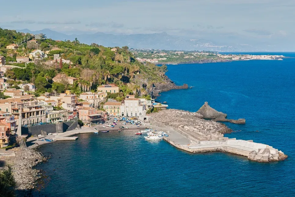 Outdoor coastal wedding reception setup overlooking the Mediterranean sea in Acireale
