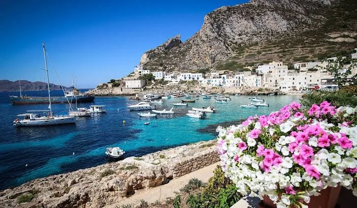 Panoramic view of the scenic coastline and sunlit historic townscape in Marsala, Sicily.