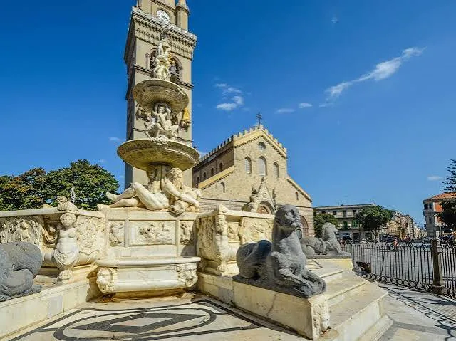 Warm Mediterranean sunlight illuminating the elegant architecture and historic streets of Messina.