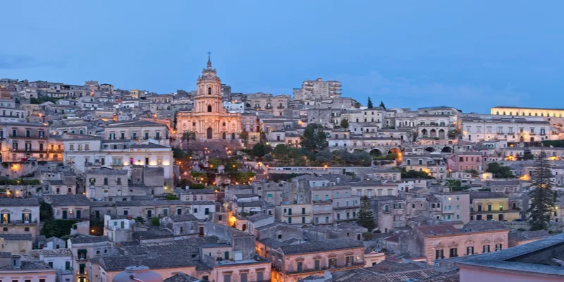 Panoramic view of the iconic Duomo di San Giorgio and baroque architecture in Modica, Sicily.