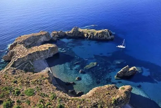 Charming narrow stone path lined with traditional Mediterranean architecture on the island of Panarea.