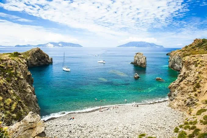 Breathtaking panoramic view overlooking the crystal-clear turquoise sea and coastal rocks of Panarea.