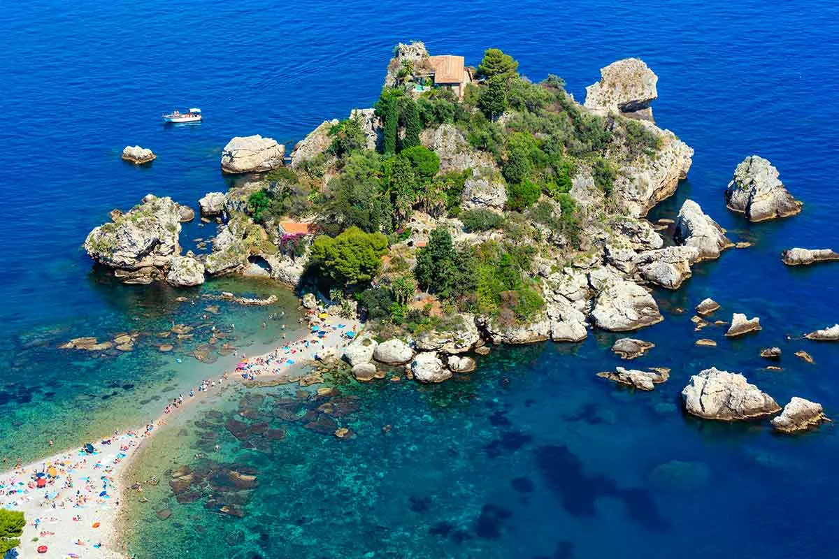 Scenic view of Isola Bella nature reserve and crystal clear waters in Taormina bay