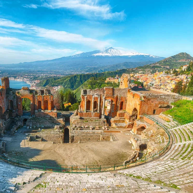 Ancient Greek Theatre of Taormina with panoramic views of Mount Etna and the sea